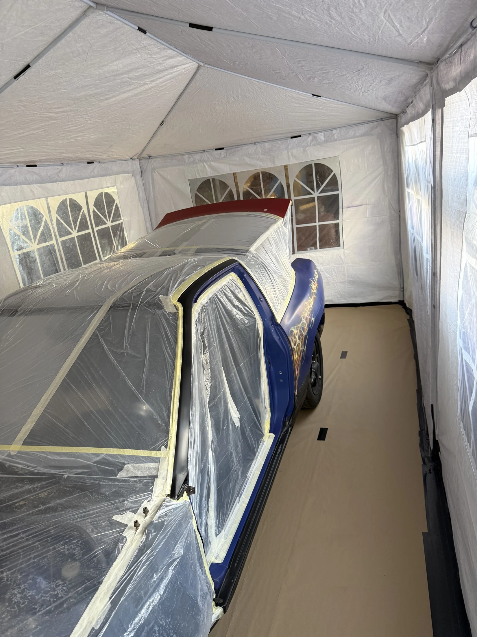 Masked S13 being prepared inside the paint booth