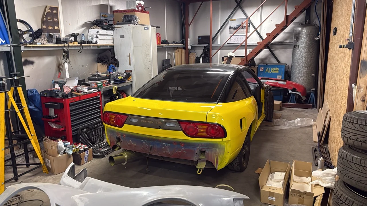 Yellow S13 with rear lights installed and bumper removed