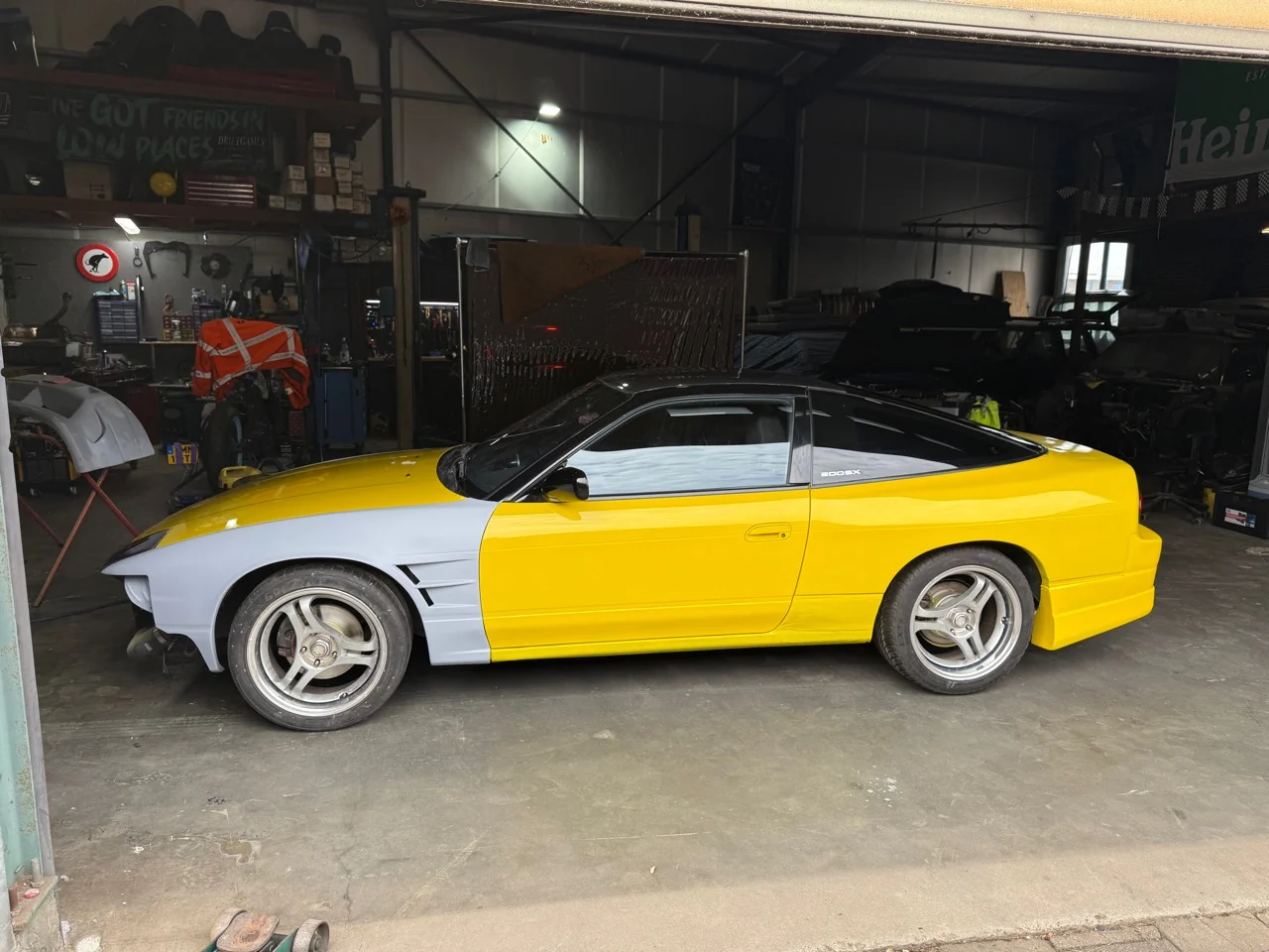 Latest side view of the Traffic Yellow S13 with its front panels still in primer