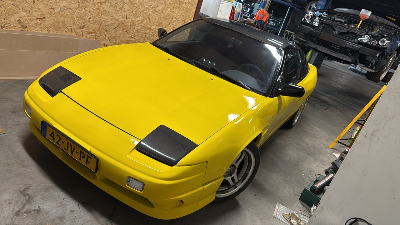 Completed Traffic Yellow Nissan 200SX S13 in the workshop before its APK